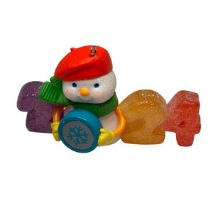 Hallmark keepsake ornament with a Snowman with Red, Purple, Yellow, and Orange